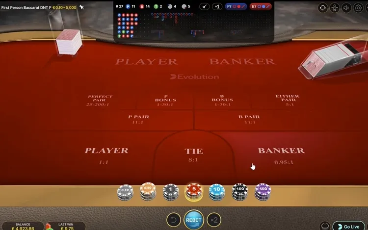 a baccarat table showing the layout and that you can play for free to learn the game